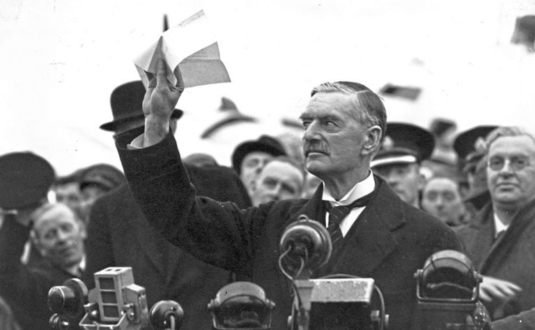 Neville Chamberlain holding the Munich agreement